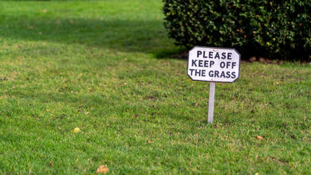 Keep off the grass sign on the lawn of a country estateの写真素材