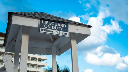 Lifeguard on Duty sign at a hotel poolsideの写真素材