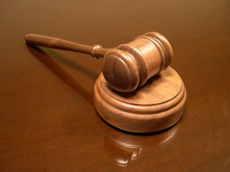 Judge's gavel on glass top.の写真素材