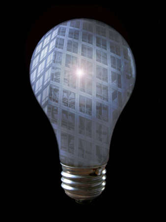 A light bulb with the reflection of a building. The building has a bright spot on it.

No bulbs were injured in the creation of this photo!の写真素材