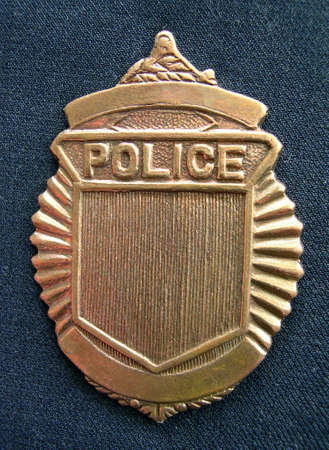 Police badge on blue uniformの写真素材