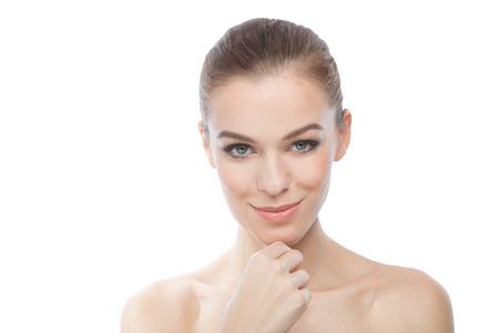 Attractive woman touching her face.の写真素材