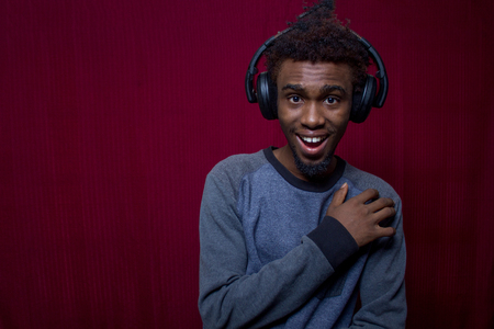 Attractive Black Young man listening to musicの写真素材