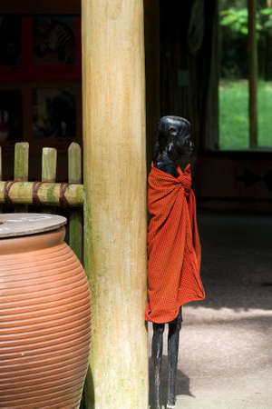 A sentry stands guard outside the village gateの写真素材