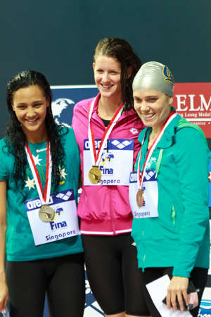 Singapore - Oct. 17: 100m IM medalists of the 2010 Fina Swimming World Cup. Gold medalist Julia Smit (USA), silver medalist (Kotuku Ngwati (AUS), bronze medalist Natalie Coughlin (USA)のeditorial素材