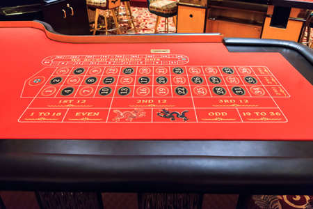 Close up of the betting portion of an empty red felted roulette tableのeditorial素材