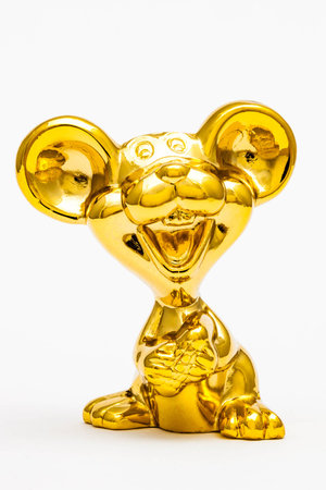 Golden figurine of the chinese zodiac sign of the rat.の写真素材
