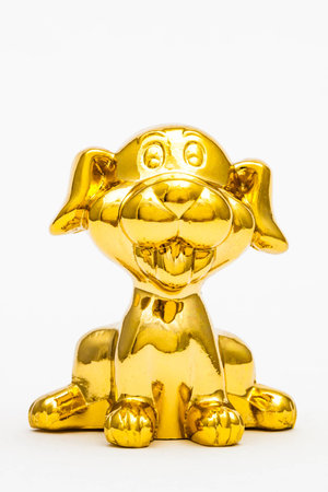 Golden figurine of the chinese zodiac sign of the dog.の写真素材