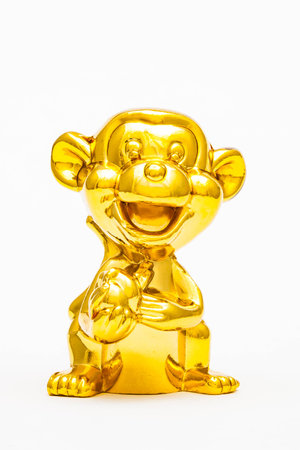 Golden figurine of the chinese zodiac sign of the monkey.の写真素材