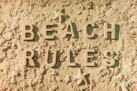 Beach rules message in the sand.の写真素材