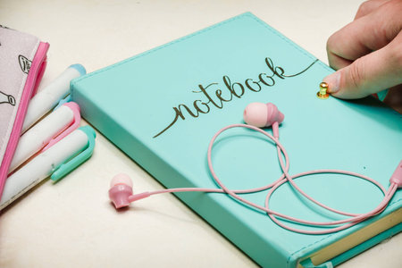 A young girl opening her pastel journal.の写真素材