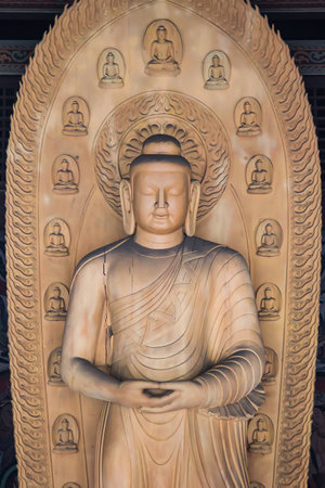 Carved wooden Buddha Sculpture housed in a temple dating back to the Ming Dynastyの写真素材
