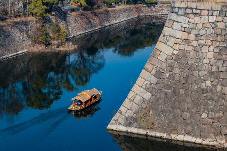 A tour boat sailing in the moat around Osaka Castleのeditorial素材