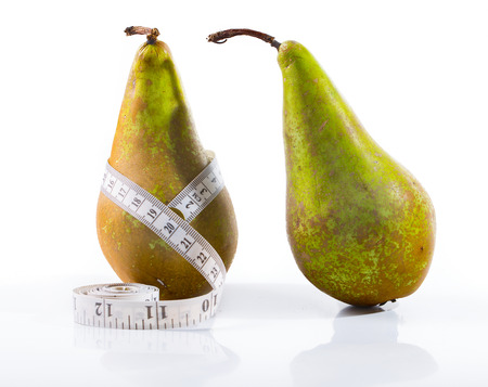 Diet and healthy lifestyle. The conceptual image, pears measure waist volumeの写真素材