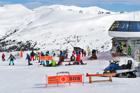 PYRENEES, ANDORRA - FEBRUARY 10, 2017: Exit from the elevator about medical aid station on a slope in mountains. Nearby life-saving station and snowmobile of rescuersのeditorial素材