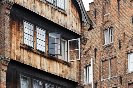 BRUGES, BELGIUM - JUNE 8, 2017: Fragment of a facade of Relais Bourgondisch Cruyce hotel. View from side of the canal, from waterのeditorial素材