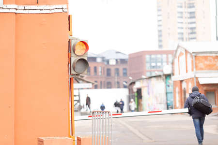 Traffic lights and a barrier at the entrance to the city yard.の写真素材