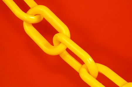 Yellow Chain on a Orange Backgroundの写真素材