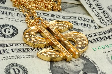 Gold Dollar Sign Necklace and Moneyの写真素材