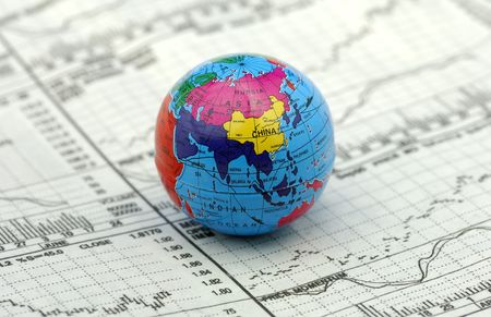 Global Markets Concept - Stock Charts and a Globe