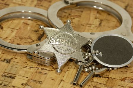 Sheriff's Badge and Handcuffsの写真素材