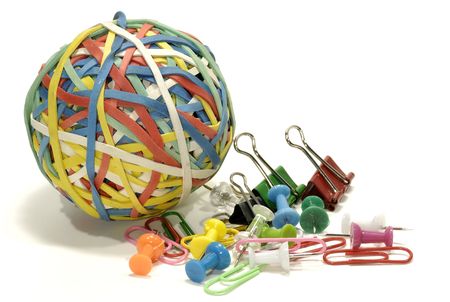 Rubberband Ball with Paperclips and Thumbtacks - Office Supplies Conceptの写真素材