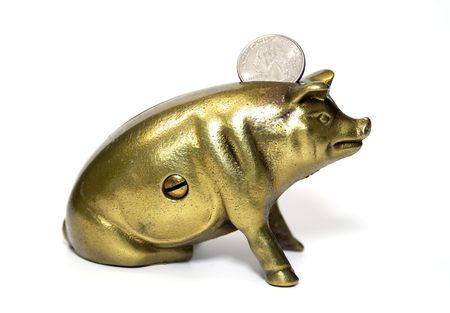 Photo of a Brass Piggybank and a Quarter / Banking Conceptの写真素材