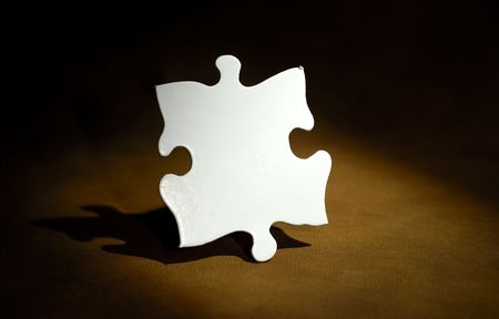 Photo of a White Puzzle Pieceの写真素材