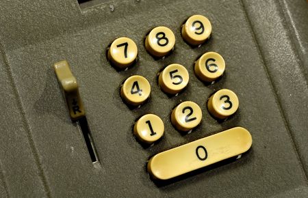 Photo of Number Buttons on a Vintage Adding Machineの写真素材