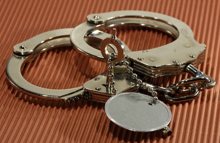 Photo of Handcuffs with a Key - Law Enforcement