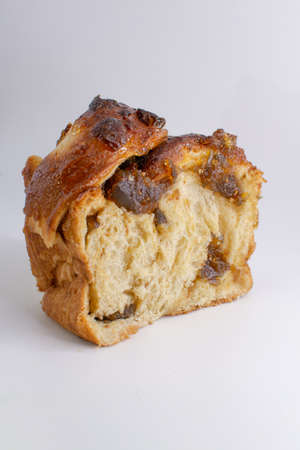 Slices of raisin bread with raisins on a white backgroundの写真素材