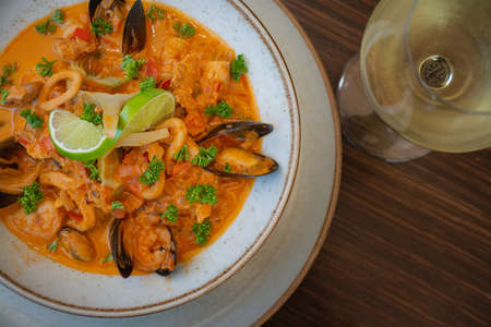 Tom Yum Goong, Thai spicy seafood soup with shrimp, mussels, squidの写真素材