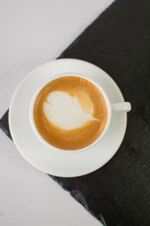 Cup of coffee latte art on white background, stock photoの写真素材