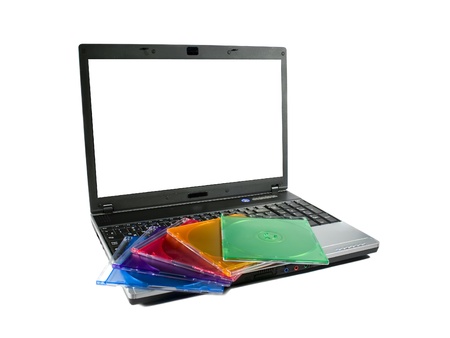 Colored cd`s on a laptopの写真素材