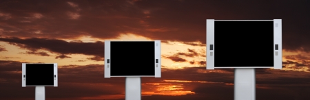 Blank advertising billboards with sunset sky backgroundの写真素材