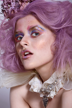 Girl with bright makeup and choker necklace. Purple hairの写真素材
