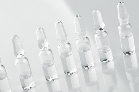 Ampoules with medicine on white background.の写真素材