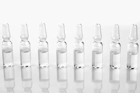 Ampoules with medicine on white background.の写真素材