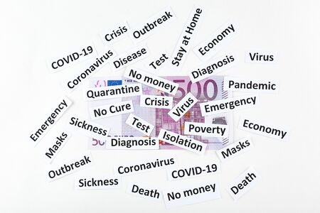 Coronavirus, COVID-19 headline clippings on 500 Euro banknote.の写真素材