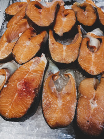 Fresh trout pieces chilled in iceの写真素材