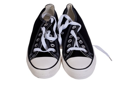 Pair of new black sneakers isolated on whiteの写真素材