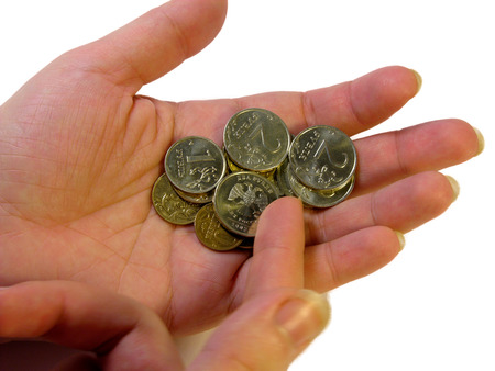 loose change in her hand  isolated on white 
