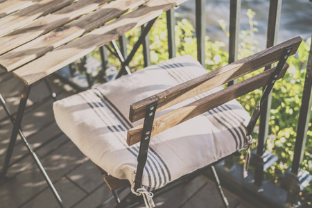 outdoor table and two chairs near the wall at coffee shopの写真素材
