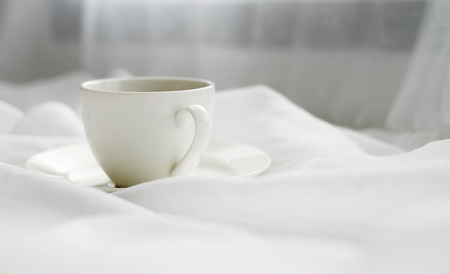 Cup on fabic white background photo imageの写真素材