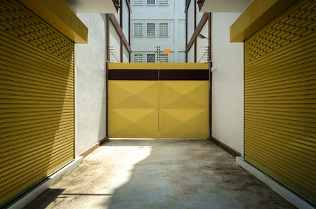 Yellow door with warehouse closeup photo stock