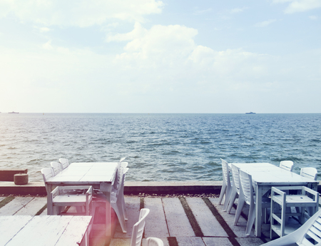 table in the restaurant on the sea backgroundの写真素材