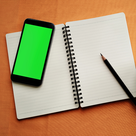 Journal book and smart phoneの写真素材