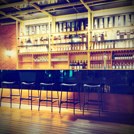 Interior of a modern pub or bar at nightの写真素材