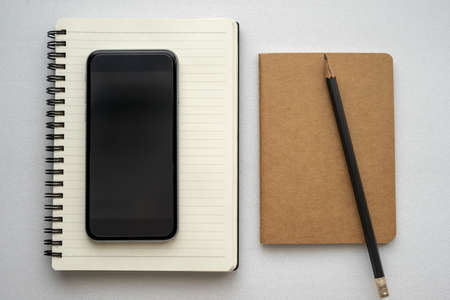 Journal book and smart phoneの写真素材