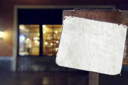 sign hanging outside a restaurant, store, office or otherの写真素材